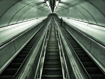 Low angle view of illuminated escalator