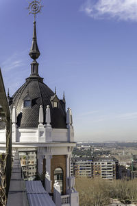 Church in city against sky