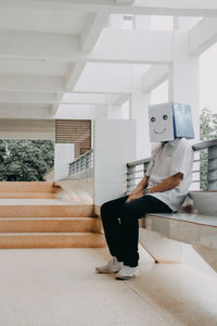 Man sitting on staircase