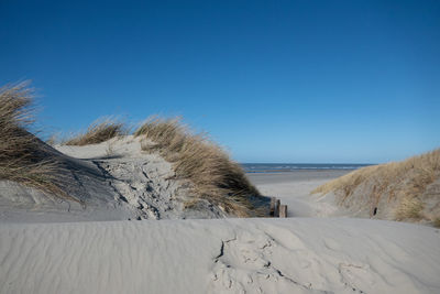 Scenic view of sea against clear sky during winter