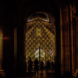 Silhouette people in museum