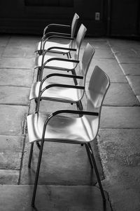 High angle view of empty chair on table
