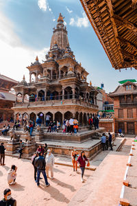 Group of people in front of historic building