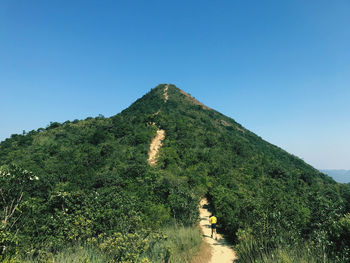 Scenic view of mountains against clear blue sky