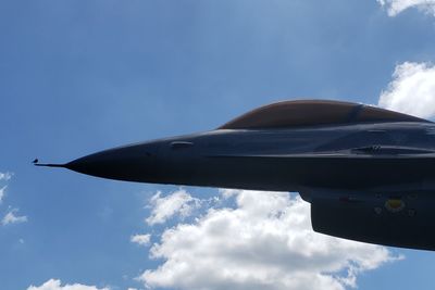 Low angle view of airplane flying in sky