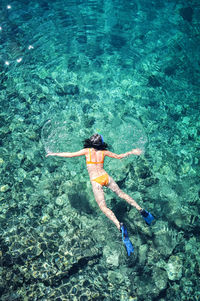 High angle view of person swimming in sea