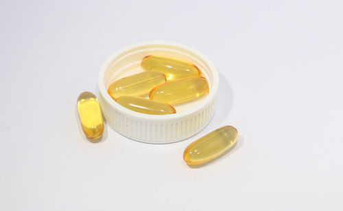 Close-up of yellow over white background