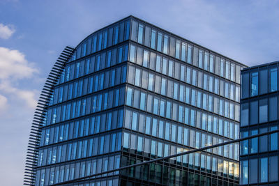 Low angle view of skyscraper against sky