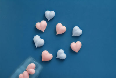 High angle view of human hand against blue background