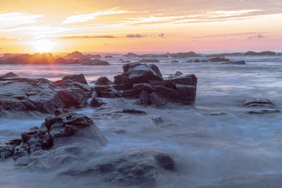 Scenic view of sea against sky during sunset