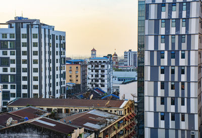 High angle view of buildings in city against sky