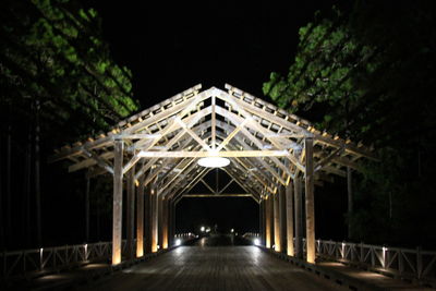 Illuminated bridge at night