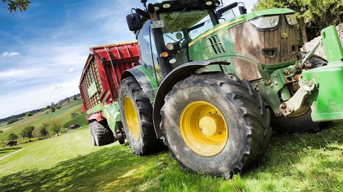 Tractor on field against sky