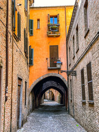 Alley amidst buildings in city