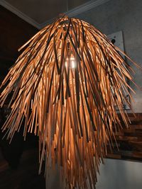 Low angle view of illuminated lights hanging on ceiling