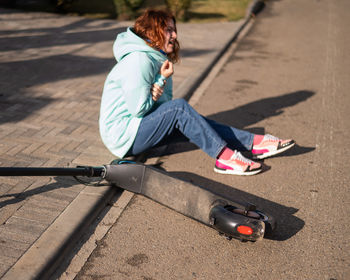 Side view of woman exercising on road