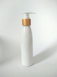 Close-up of bottle against white background