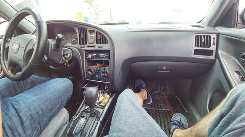 High angle view of people sitting in car