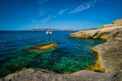 Scenic view of sea against blue sky