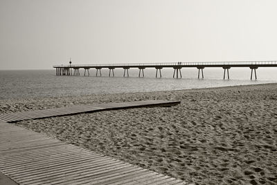 Scenic view of bridge over sea against clear sky