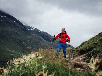 Rear view of man standing on mountain
