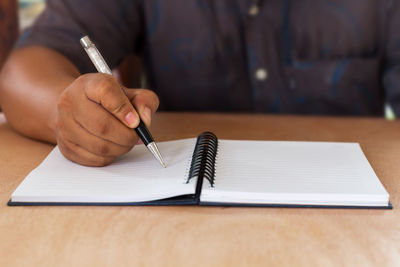 Close-up of hand writing