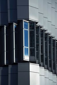 Low angle view of modern building against sky in city