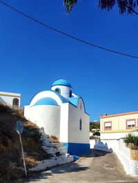 View of temple against clear blue sky