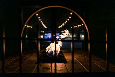 People sitting in illuminated stage at night