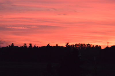 Silhouette trees against sky during sunset