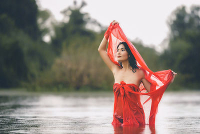 Portrait of a young woman with red water