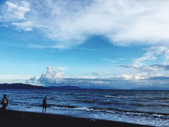 Scenic view of sea against cloudy sky