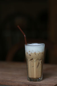 Close-up of iced coffee on wooden table