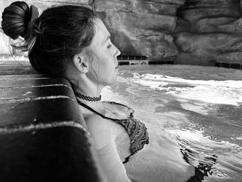 Portrait of woman looking at swimming pool