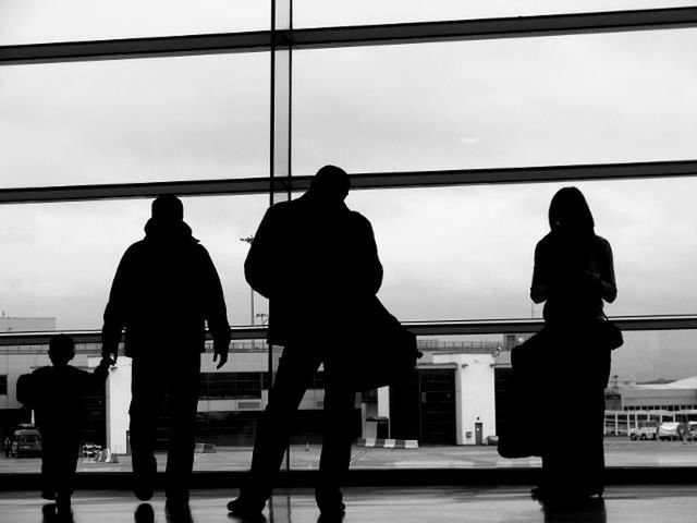 REAR VIEW OF SILHOUETTE PEOPLE ON AIRPORT