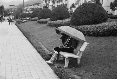 High angle view of man sitting in park