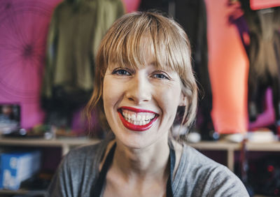 Portrait of happy female mechanic in workshop