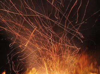 Firework display in sky at night