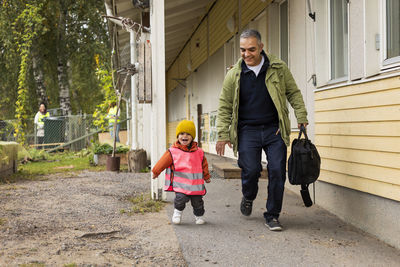 Father collecting child from school