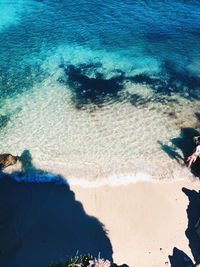 High angle view of waves on beach