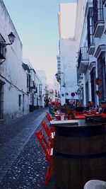 Street in city against clear sky