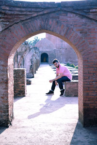 Woman in corridor of historic building