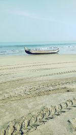 Scenic view of beach against clear sky