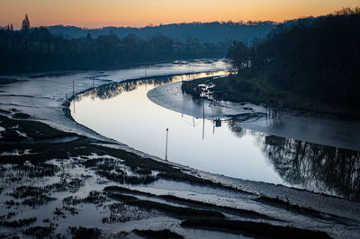 High angle view of river against sky at sunset