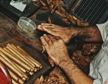 Midsection of man working at workshop