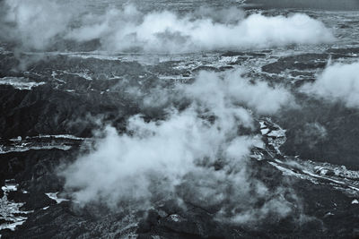 Aerial view of landscape against clouds