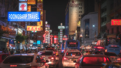 Illuminated city street at night