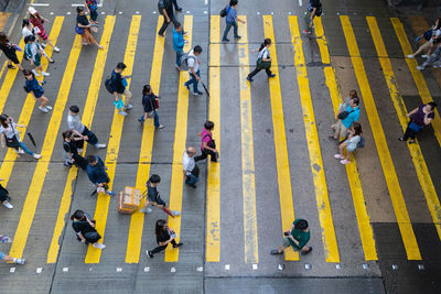 High angle view of people crossing road