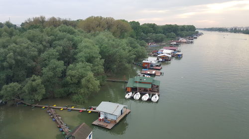 High angel view of trees by river against sky