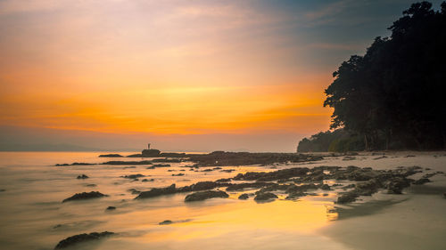 Scenic view of sea against sky during sunset